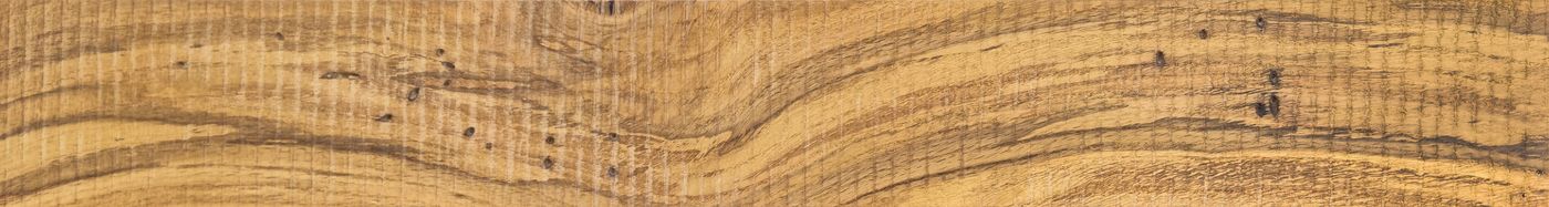 Comparación de superficies: capa de madera real frente a una lámina impresa.